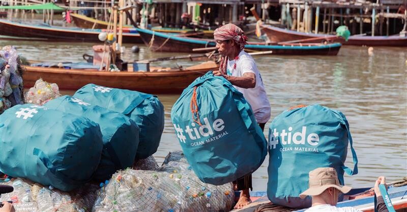 Fisherman loading plastic boat
